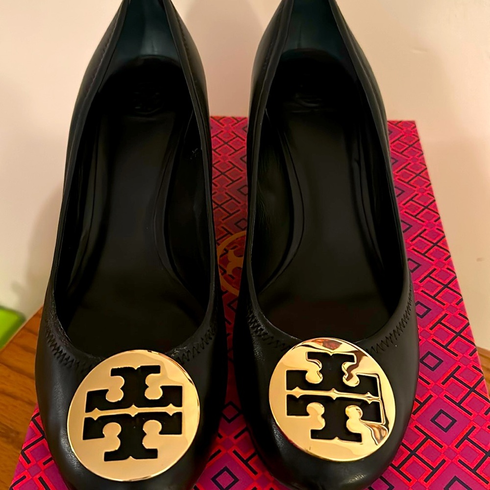Tory Burch size 11 black Sally wedge with gold emblem on the toe. With box